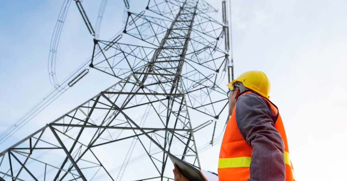 Engineering working on High-voltage tower