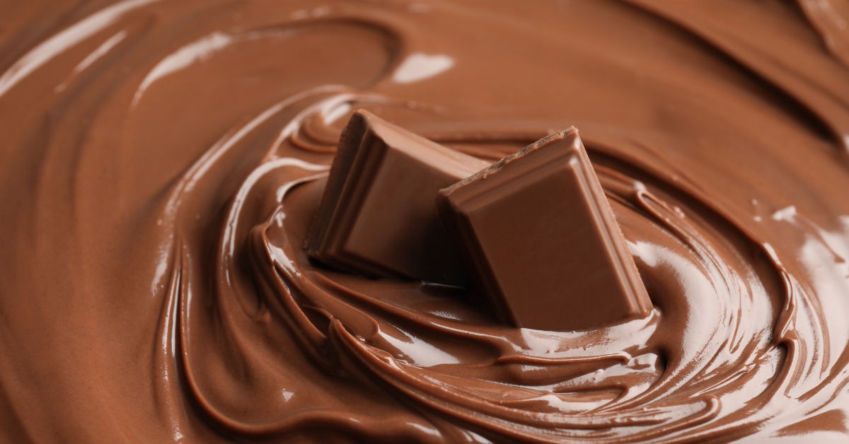 chocolate cream with pieces as background