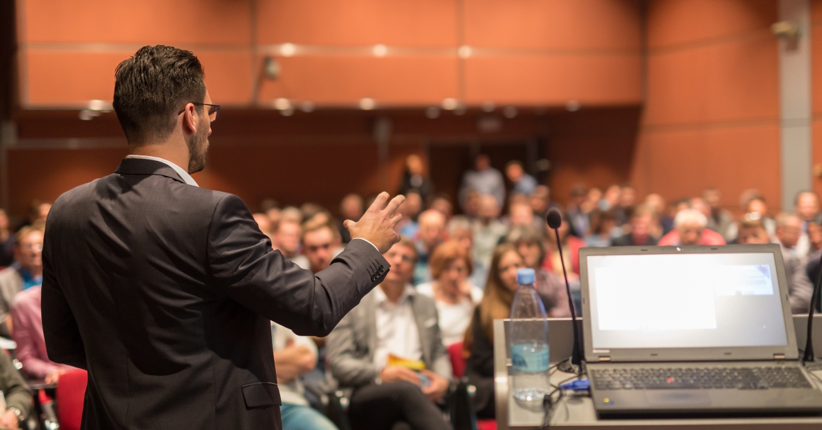 Speaker giving a talk on corporate Business Conference