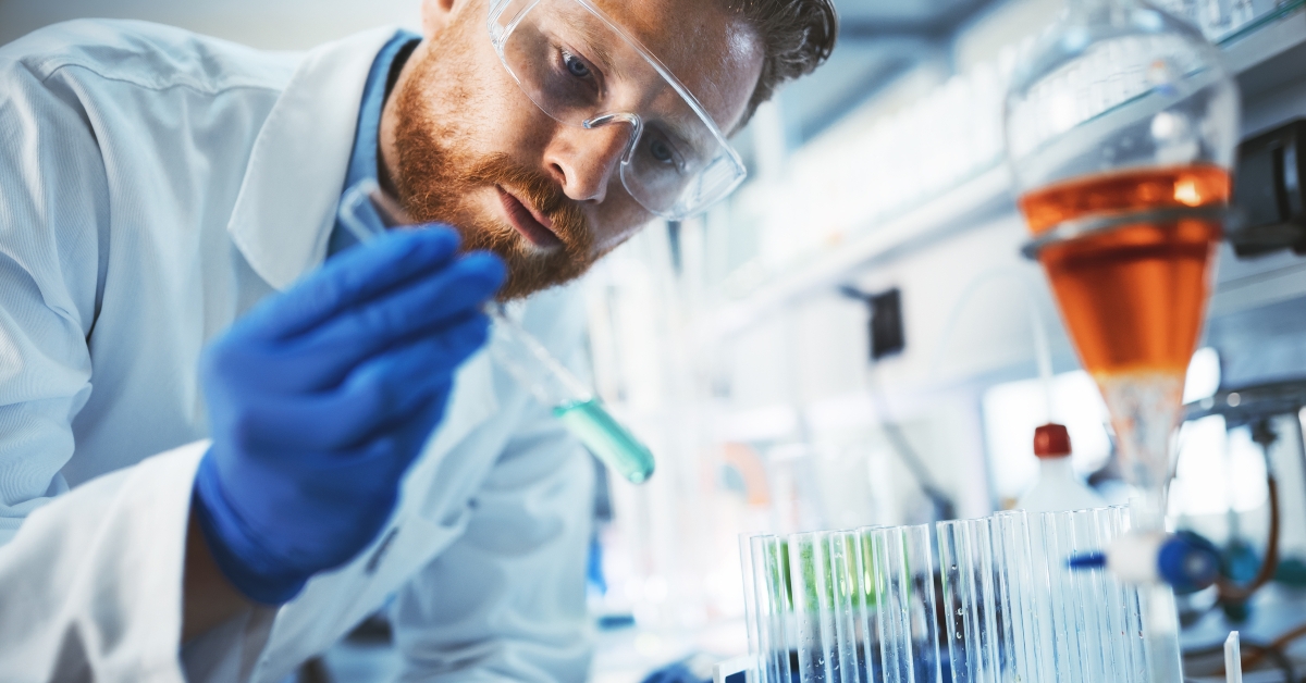 Male student of chemistry working in laboratory