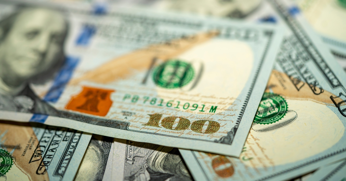 scattered hundred dollar bills