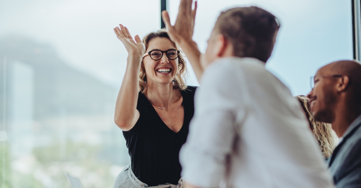 giving a high five to a colleague