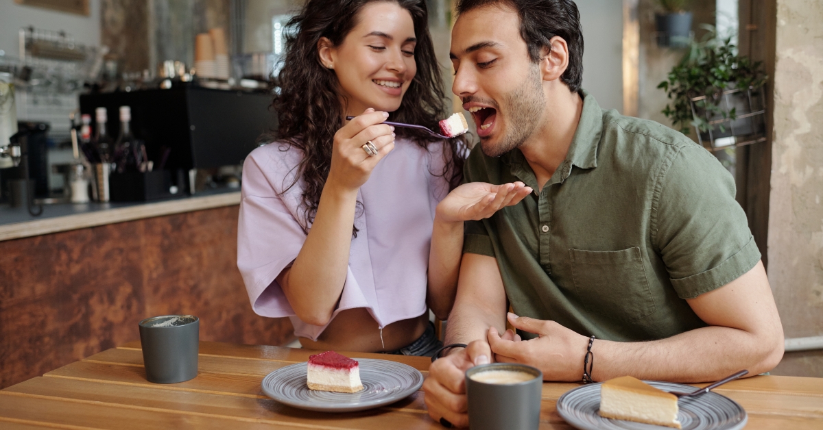 eating piece of tasty cheesecake