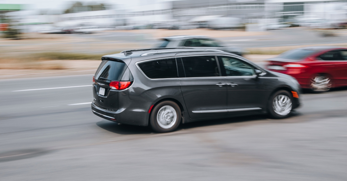 Black Chrysler Pacifica car moving on the street