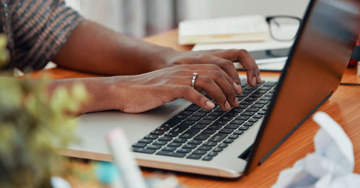 businesswoman working on laptop and typing 