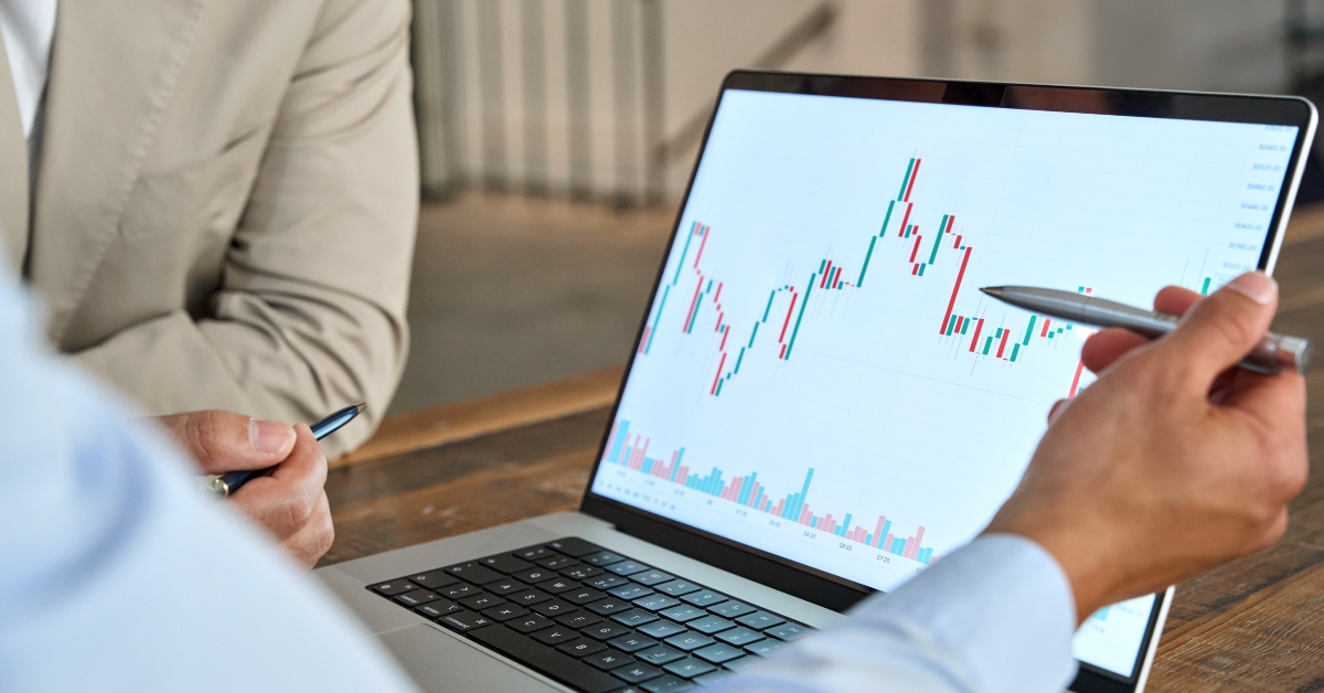 financial advisor explaining invest stock market data