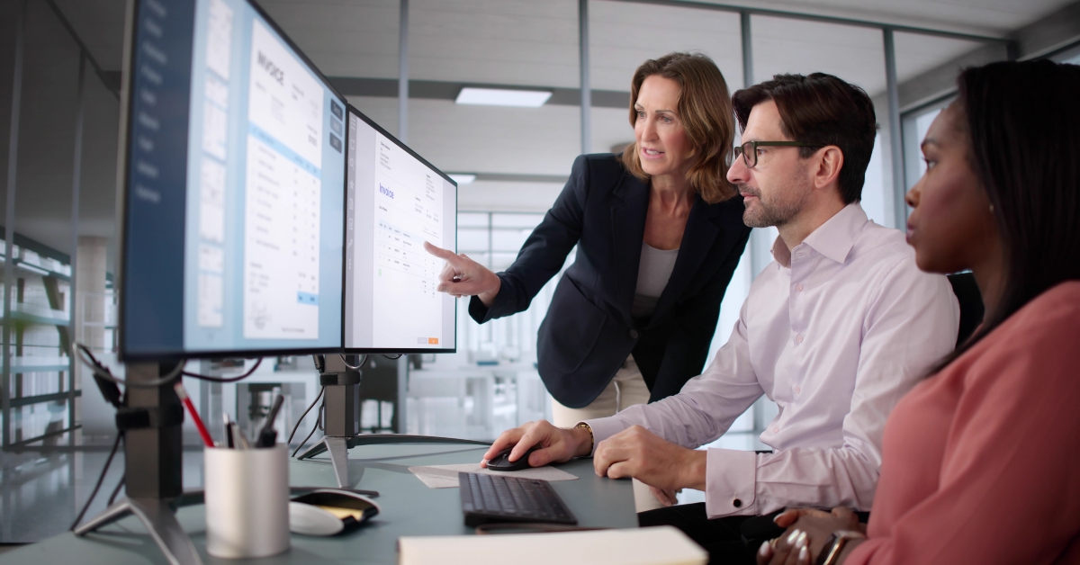 woman uses computer software to manage electronic invoices 