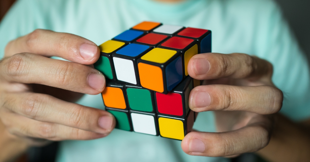 man solving rubik's cube