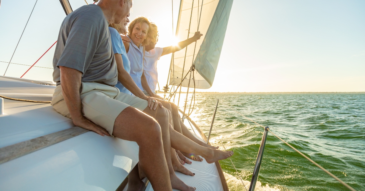 relaxed group of senior sailing luxury yacht 
