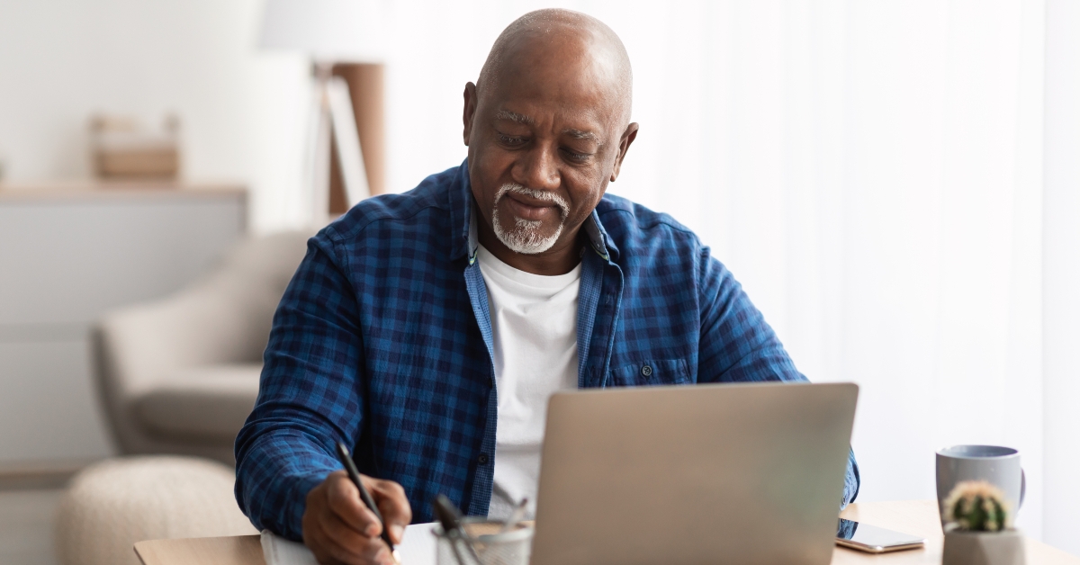 senior black man at laptop