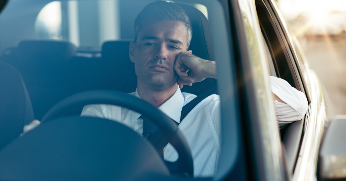 pensive businessman in his car 