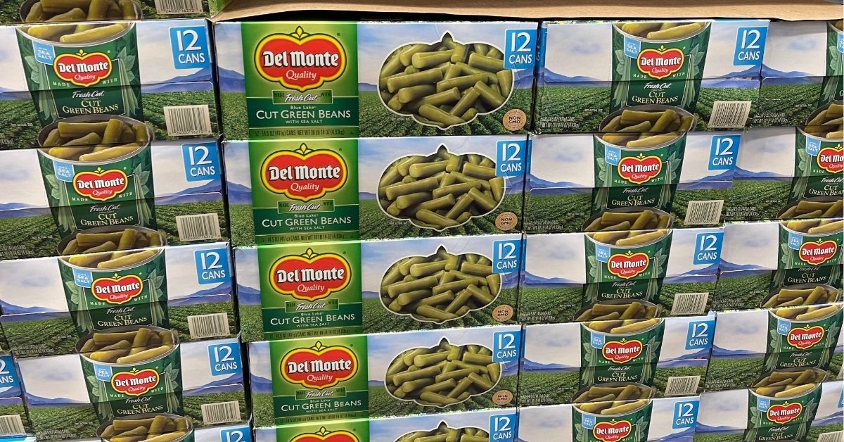 a stack of green beans in carton