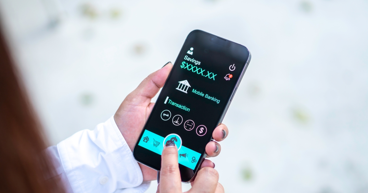 accessing mobile banking app on her smartphone