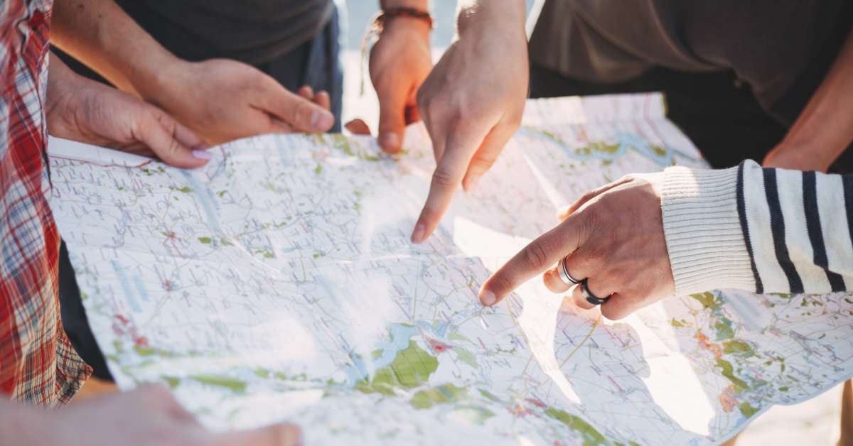 friends searching the location on map
