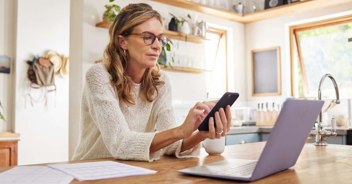 thinking mature person with technology