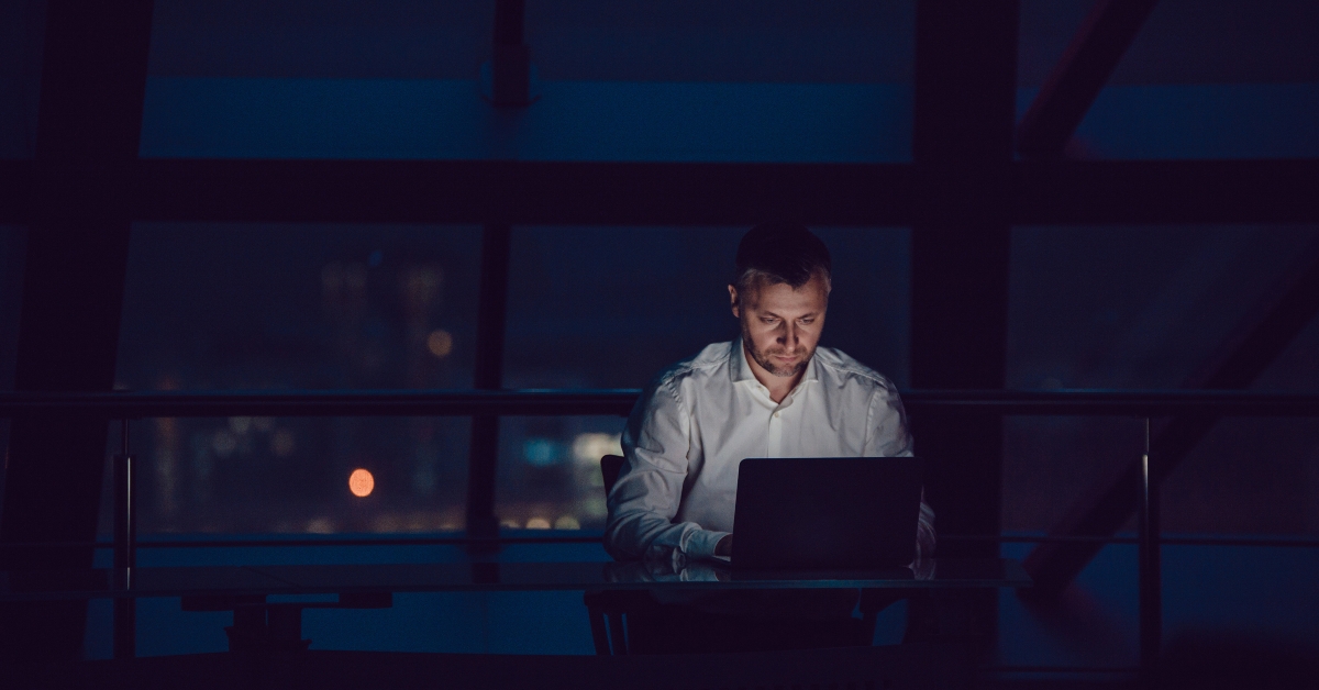 businessman working on laptop at night