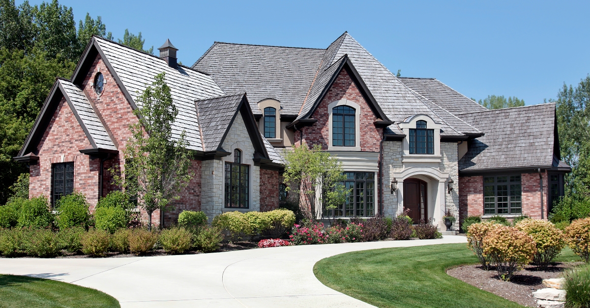 large brick home with circular driveway 
