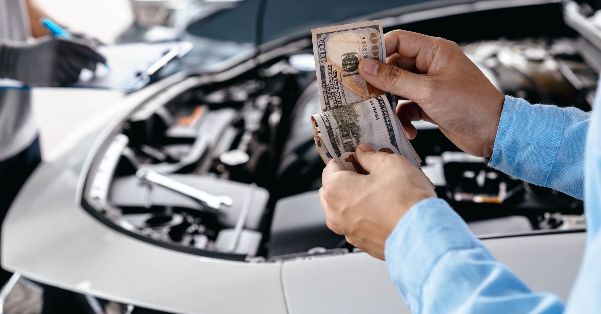 pays with money for car repair
