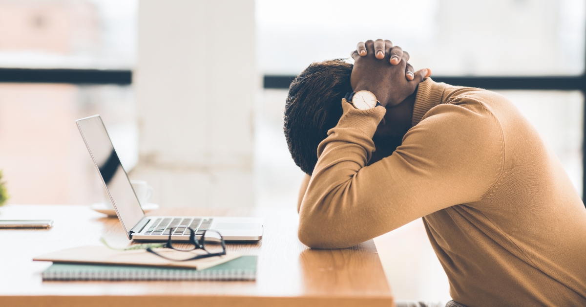 exhausted businessman feeling sad and desperate 