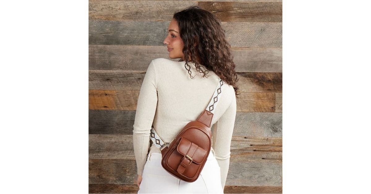 sling backpack with embroidered strap