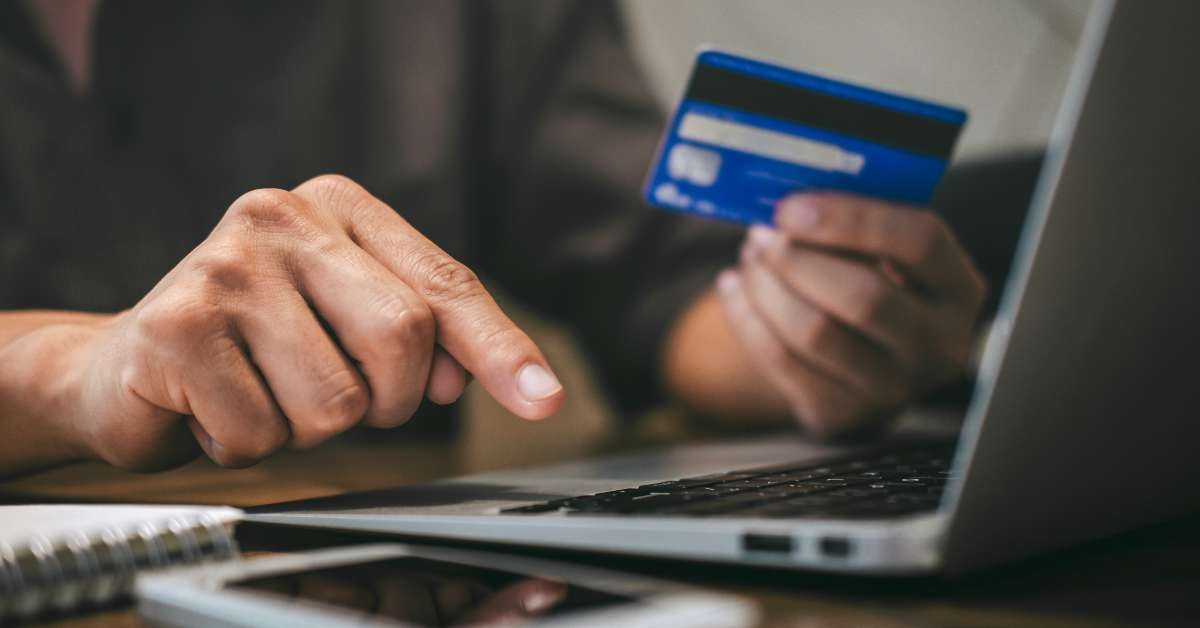 businessman holding credit card
