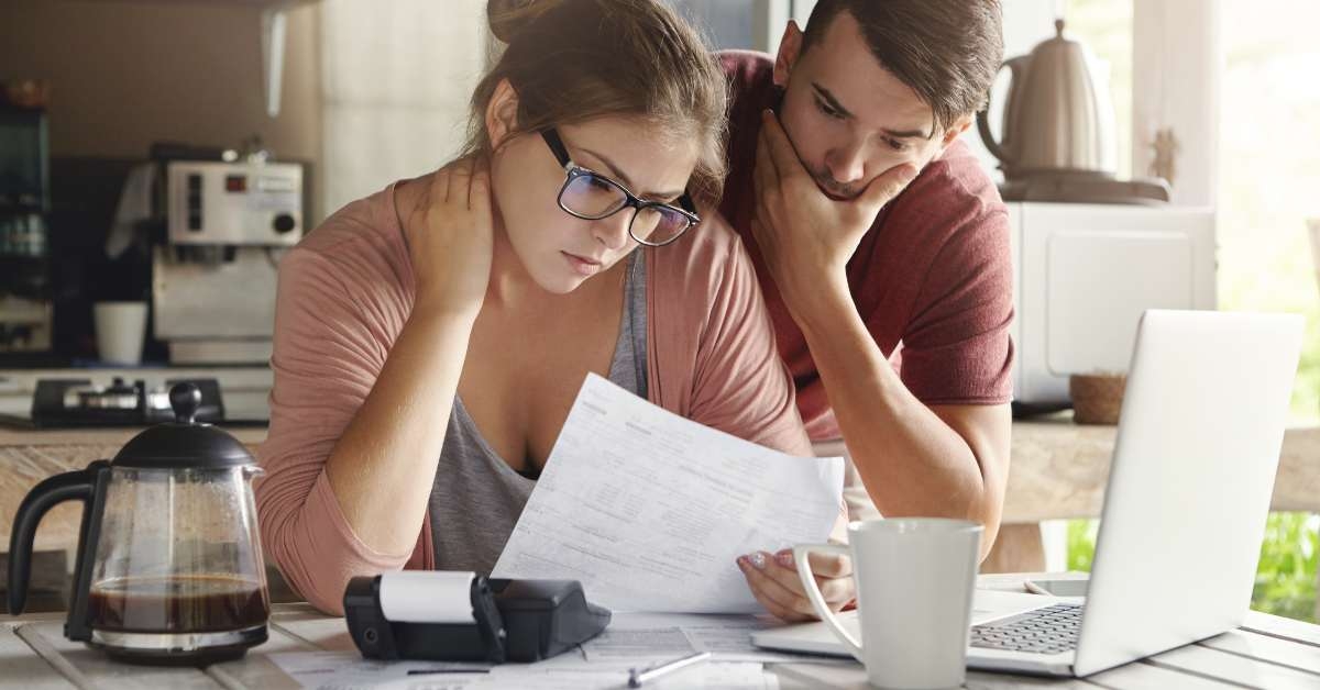 young caucasian family having debt problems