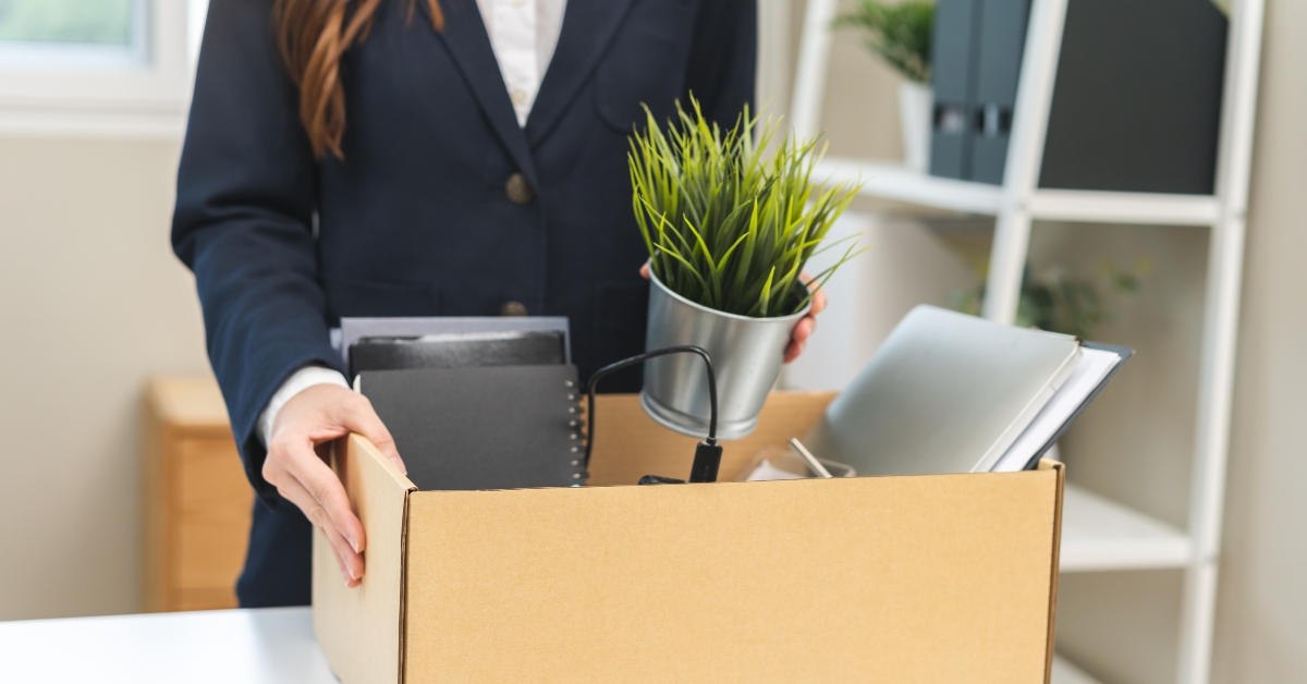 business woman packing her belongings at office