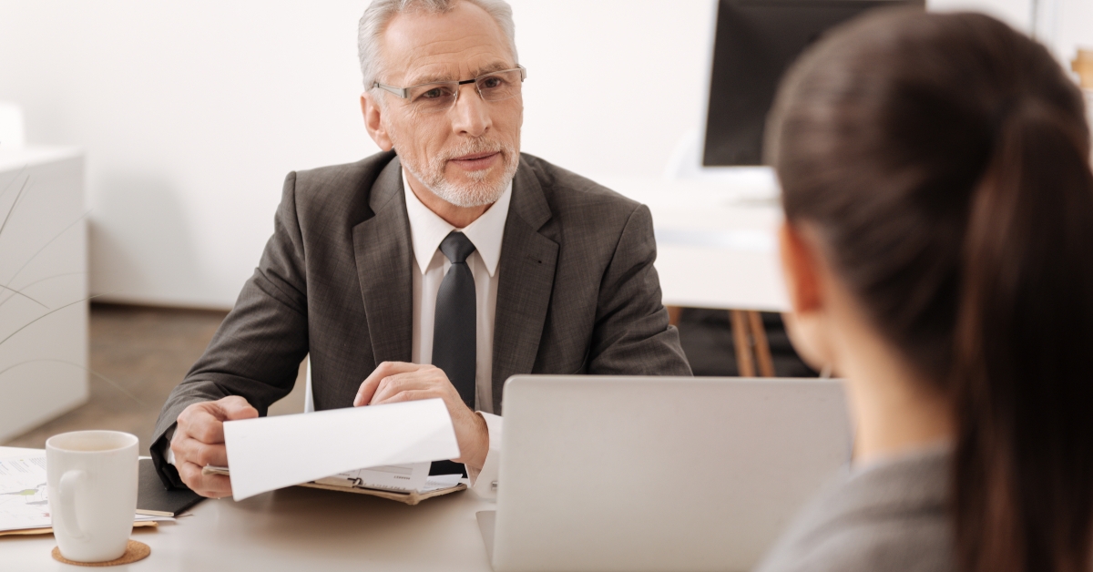 businessman talking to his secretary