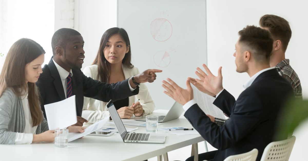 coworkers fighting during a meeting