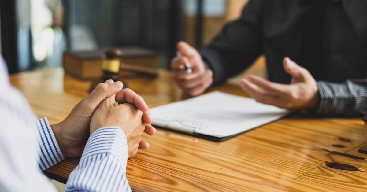 Lawyers are signing legal contract agreement documents