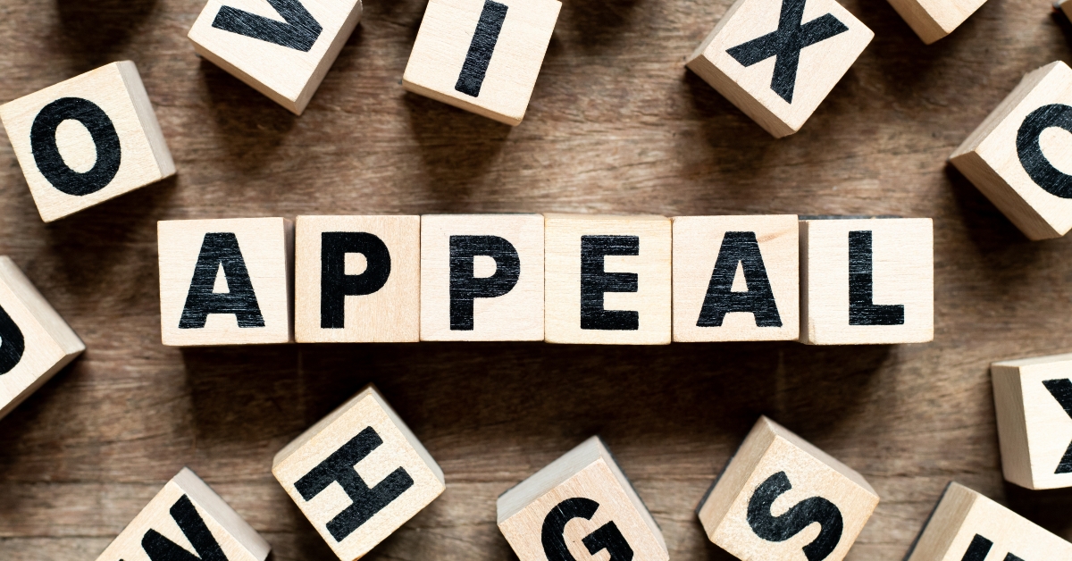 Letter block with word appeal on wood background