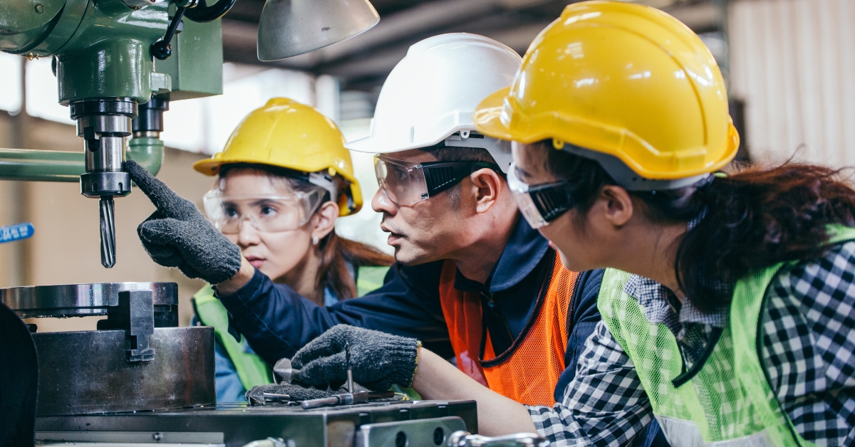 manager showing case study of machine