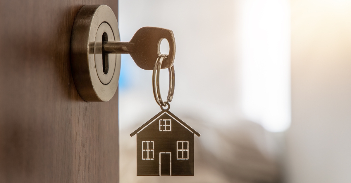new home with key and home shaped keychain