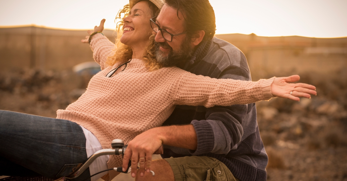 happy couple riding a bike together