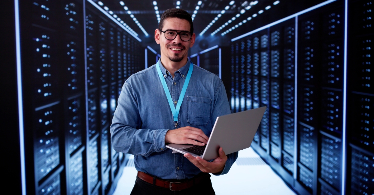 male engineer in data center server room