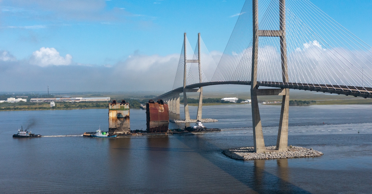 Golden Ray cargo ship towed under the Sidney Lanier Bridge