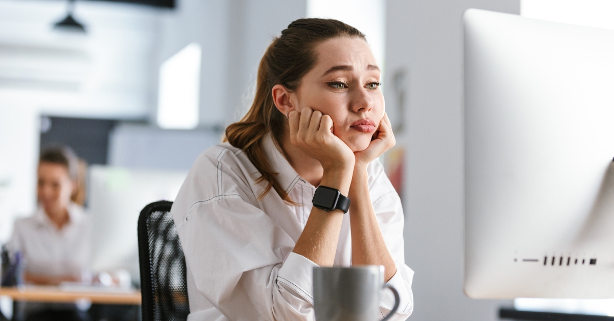 bored young woman at her workplace