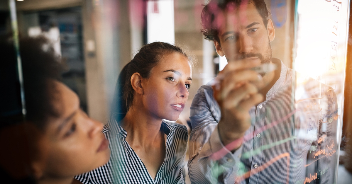Programmers cooperating at IT company developing apps