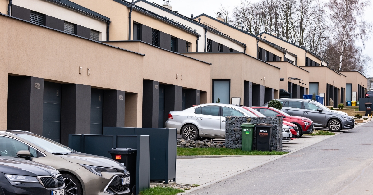 cars in front of modern family houses 