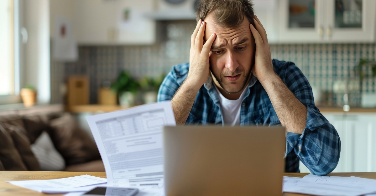 businessman feeling stressed while working