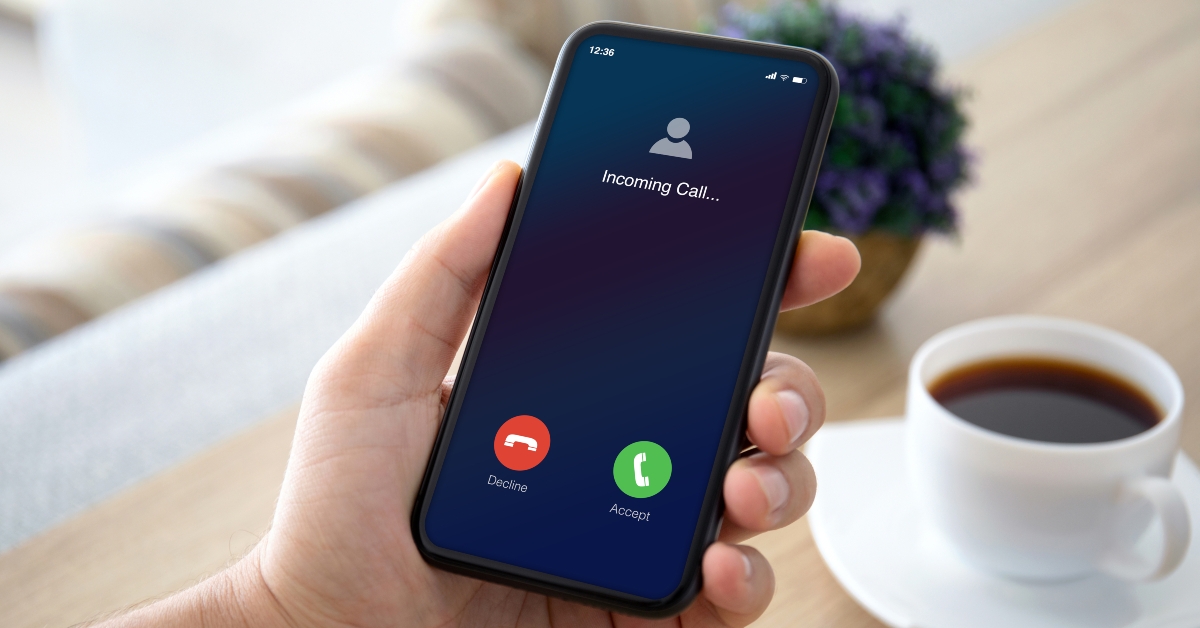 male hands holding phone with incoming call
