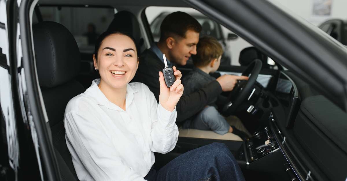 family in a car dealership