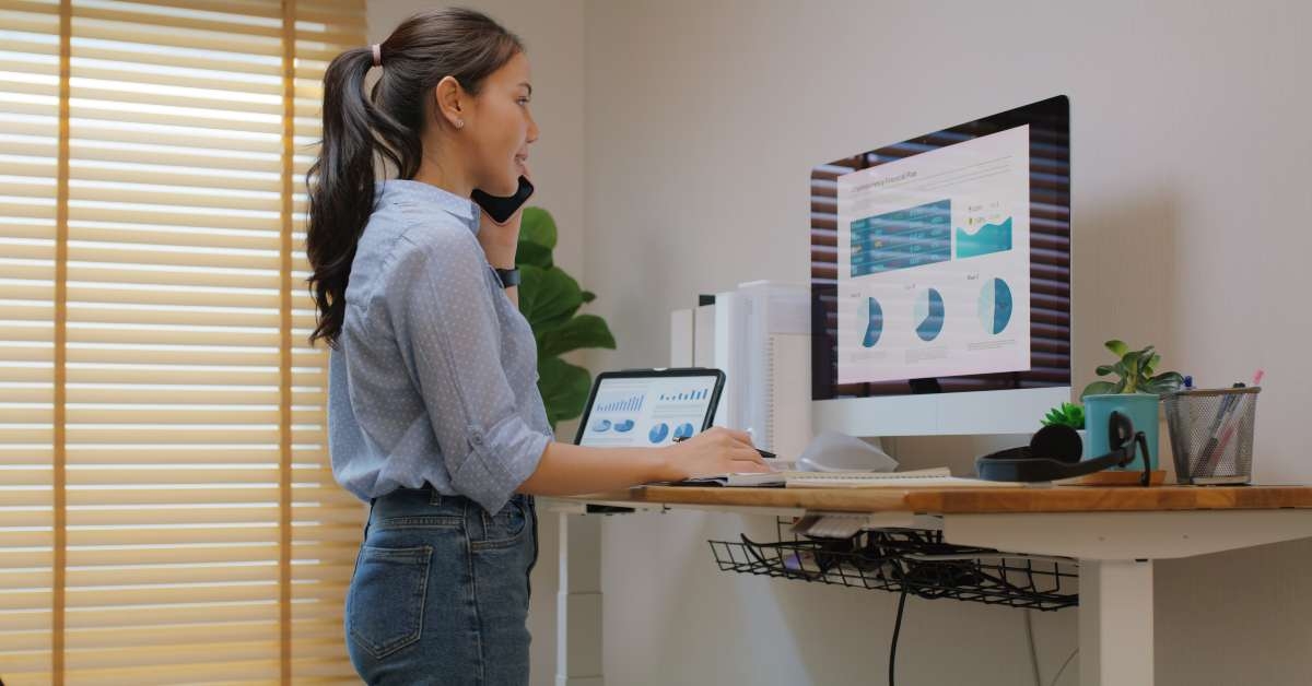 adjustable standing desk in small office