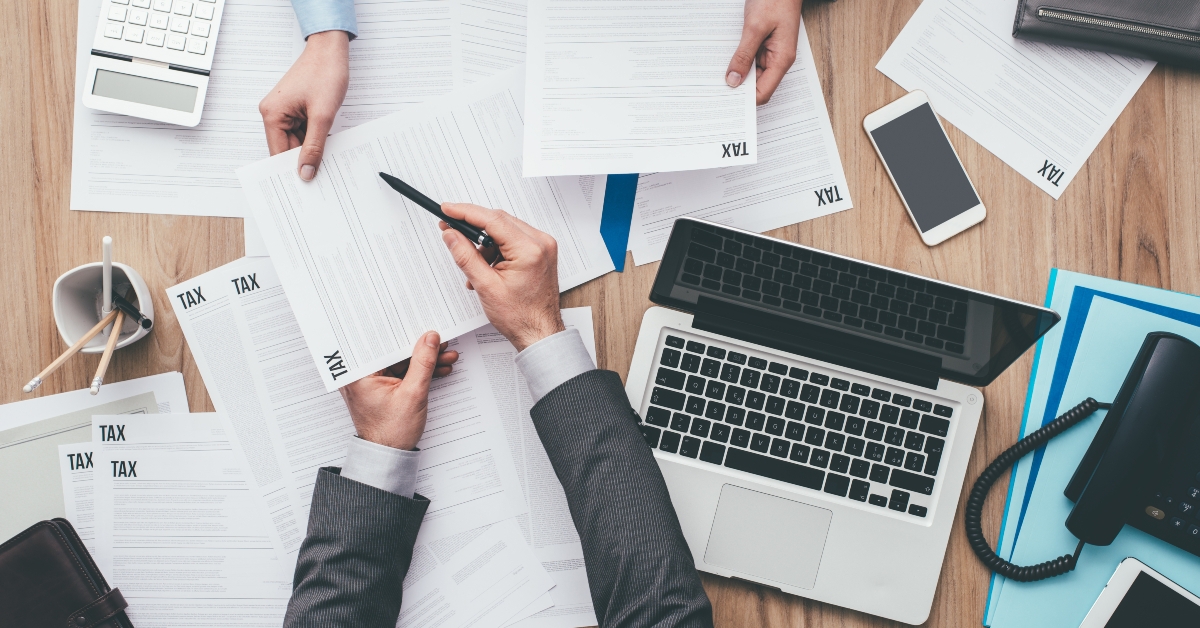 Business people checking tax forms
