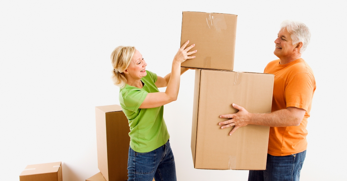 man and woman moving boxes