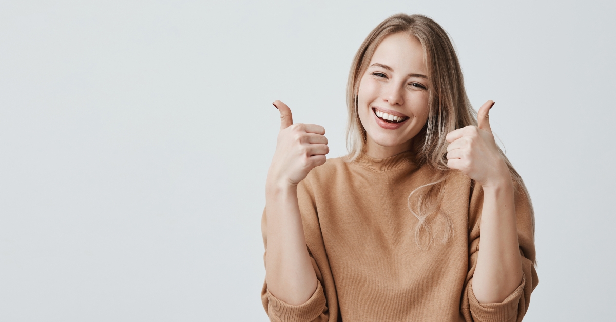 showing thumbs-up