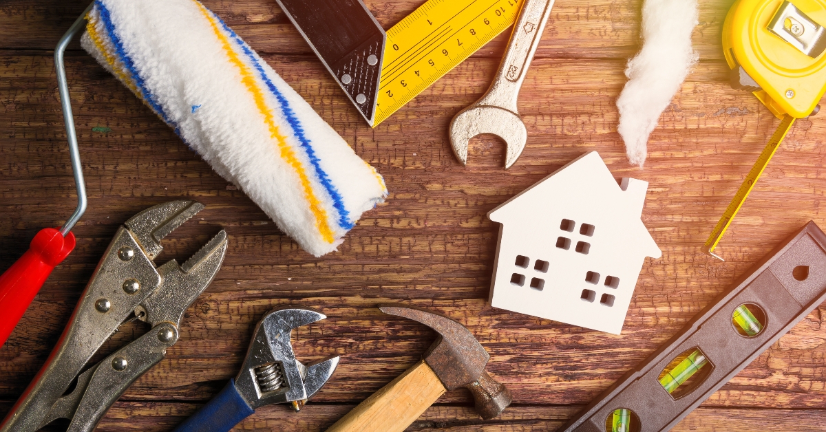 construction tools on wooden background