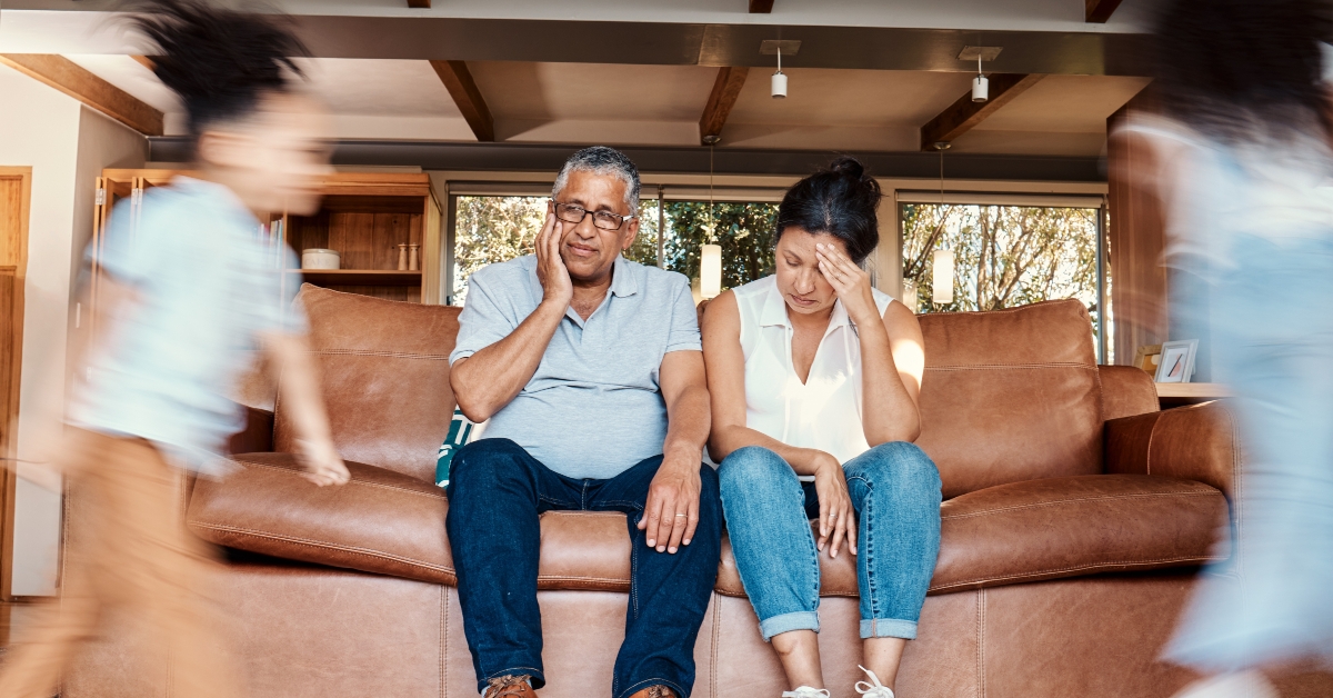 grandparents on couch tired