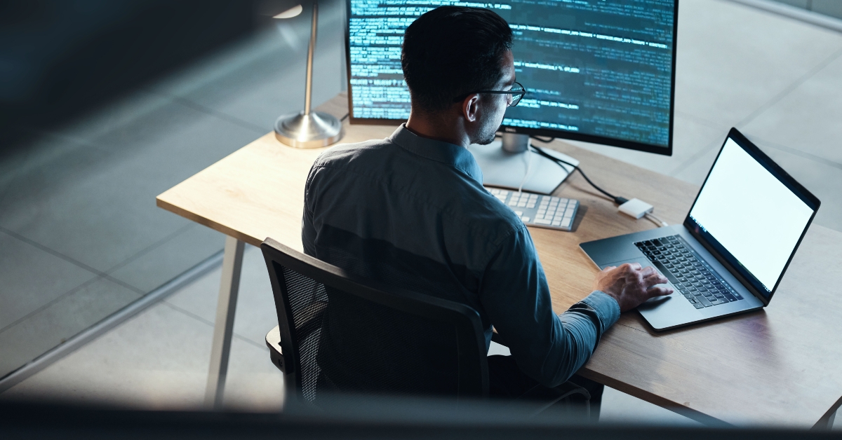 male programmer coding late at night