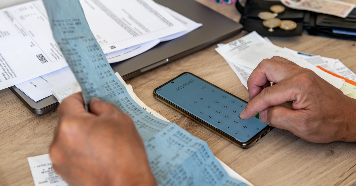 person calculating bills